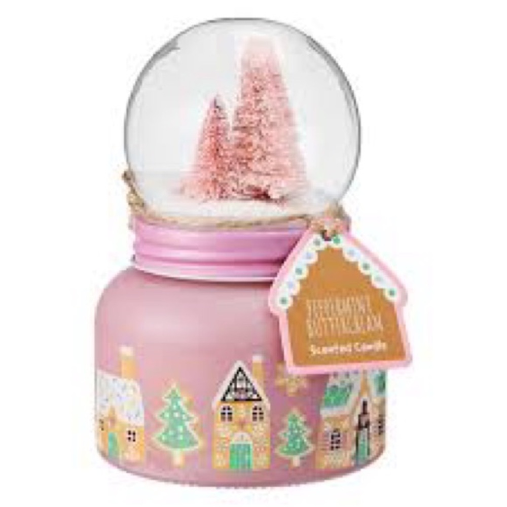 Pink gingerbread house town snow globe